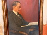 painting of a man reading a book on a table in front of a wall