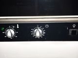 a black and white photo of a stove top oven