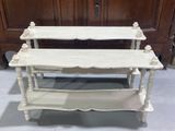 two tiered table with two shelves on top of each other