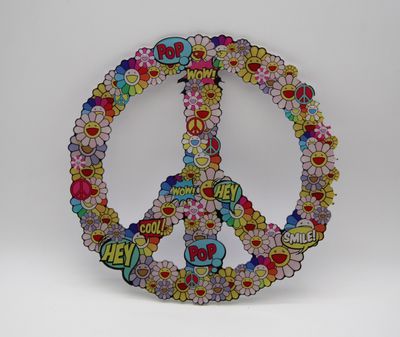 un symbole de la paix réalisé avec des fleurs et des autocollants sur un fond blanc