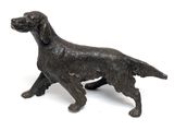 a bronze statue of a dog on a white background