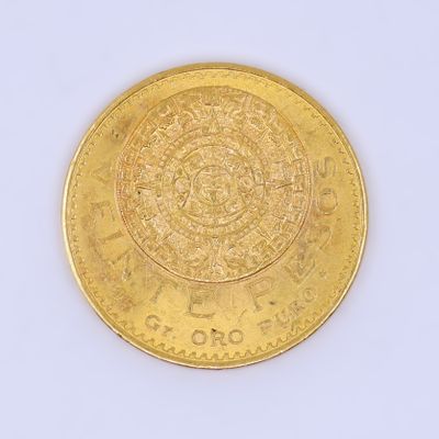 une pièce d'or sur laquelle figure un motif, sur un fond blanc
