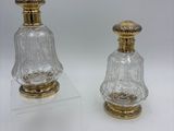 pair of antique cut glass salt and pepper shakers on acrylic bases
