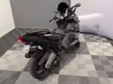 a motorcycle that is parked on a checkered floor