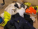 a pile of clothing on the floor in a room