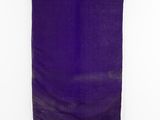 an old purple cloth hanging on a white wall