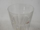 a glass that has a small red object in it
