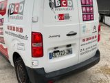 a white van that is parked in a parking lot