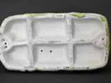 a close up of a white container on a black surface