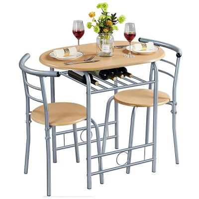 a table with two chairs and a bottle of wine on it