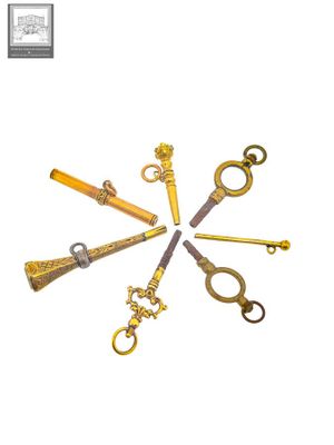 five different types of antique keys arranged in a circle