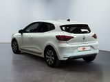 the rear end of a white car parked in a white room