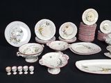 many different types of plates and bowls on the table