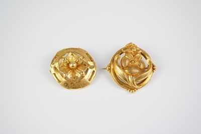 a pair of gold tone earrings with flowers and leaves