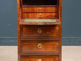 an old wooden chest of drawers with marble top