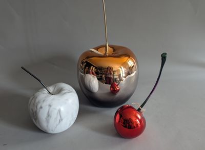 two apples that are next to each other on a table