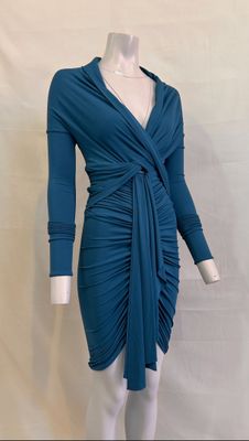 the mannequin is wearing a blue dress with a knot around the waist