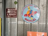 many different signs on the wall of a garage