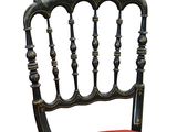 two chairs that are painted black and red with gold accents