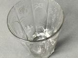 a glass bowl with a pattern on it on a table