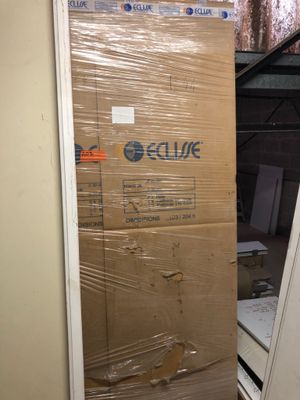 a large cardboard box sitting on the floor in a room