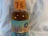 a bottle of rum that is sitting on a white sheet