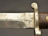 a close up of a knife with a metal handle