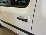 a white van with a sticker on the side of it ' s door