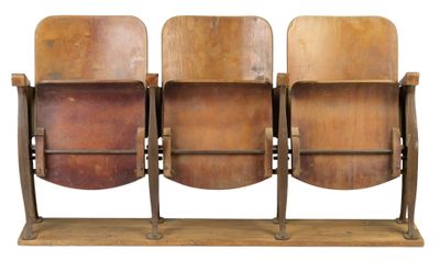 three wooden chairs that are sitting on a wooden stand