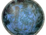 an image of a blue bowl with a drawing of a man and a horse on it