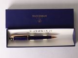 a pen in a box with a pen in it
