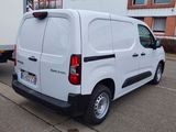 a white van that is parked in a parking lot
