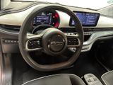 the interior of a car with a steering wheel and dashboard controls