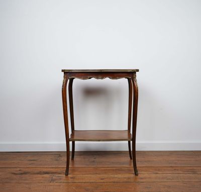a small wooden table with a shelf on top of it