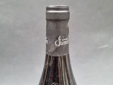 a bottle of wine that is sitting on a table