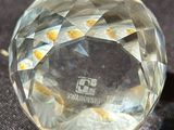 a clear crystal ball sitting on top of a table
