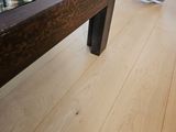 a glass top coffee table on the floor in the living room