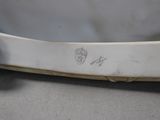a close up of a white plate with a handle on it