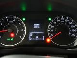 a close up of the dashboard of a car with the lights on