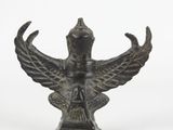 bronze statue of a bird on a pedestal on a white background