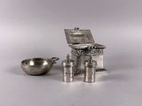a silver kitchen set with a stove and a bowl