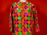 a close up of a mannequin torso with a colorful jacket on it
