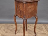 an image of a small wooden table on a parquet floor