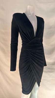 the dress is black and has long sleeves and a v - neck