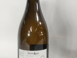 a bottle of wine that is sitting on a table