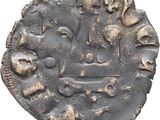 a close up of a coin with a face on it