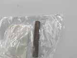 a small screw that is in a bag on a table