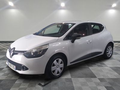the white car is parked on a checkered floor in the garage