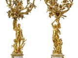 pair of gilet candlesticks in the form of cherensils