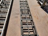 two ladders that are sitting on the ground